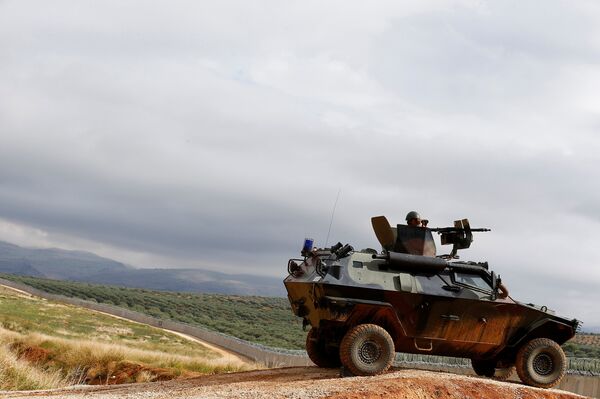 A Turkish soldier on armoured military vehicle patrols the border between Turkey and Syria, near the southeastern village of Besarslan, in Hatay province, Turkey, November 1, 2016 A Turkish soldier on armoured military vehicle patrols the border between Turkey and Syria, near the southeastern village of Besarslan, in Hatay province, Turkey, November 1, 2016 - Sputnik International
