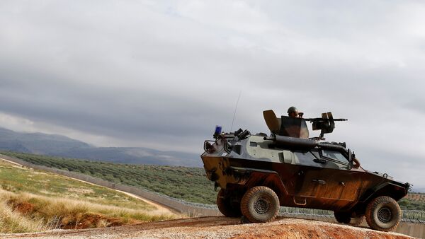A Turkish soldier on armoured military vehicle patrols the border between Turkey and Syria, near the southeastern village of Besarslan, in Hatay province, Turkey, November 1, 2016 - Sputnik International