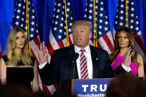 Donald Trump is joined by his daughter Ivanka, left, and wife Melania as he speaks during a news conference at the Trump National Golf Club Westchester, Tuesday, June 7, 2016, in Briarcliff Manor, NY. Donald Trump is joined by his daughter Ivanka, left, and wife Melania as he speaks during a news conference at the Trump National Golf Club Westchester, Tuesday, June 7, 2016, in Briarcliff Manor, NY. - Sputnik International