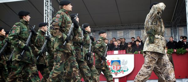 Latvian soldiers march during a military parade on November 18 (File) Latvian soldiers march during a military parade on November 18 (File) - Sputnik International