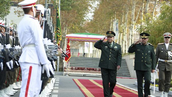 In this picture released by the Iranian Defense Ministry, Chinese Defense Minister Chang Wanquan, center, reviews an honor guard while he is welcomed by his Iranian counterpart Gen. Hossein Dehghan, in Tehran, Iran, Monday, Nov. 14, 2016 - Sputnik International
