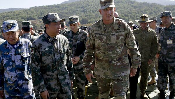 U.S. Army Pacific commander Gen. Robert Brown, center right, and Gen. Liu Xiaowu, center left, the commander for Southern Theater Command Army of Chinese Liberation Army (PLA), inspect a rescue operation venue for the U.S.-China Disaster Management Exchange (DME) drill at a PLA's training base in Kunming, southwestern China's Yunnan Province, Friday, Nov. 18, 2016 - Sputnik International