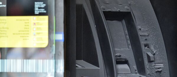 An electronic cash machine is burned at a branch of the Commonwealth Bank after a fire injured customers in Melbourne, Australia November 18, 2016 - Sputnik International
