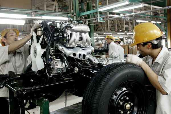 Workers assemble a vehicle at a Toyota motor plant in Vinh Phuc (File) Workers assemble a vehicle at a Toyota motor plant in Vinh Phuc (File) - Sputnik International
