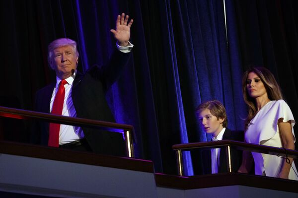 President-elect Donald Trump, left, walks with his son Barron, center, and wife Melania, to speak at an election night rally, Wednesday, Nov. 9, 2016, in New York - Sputnik International