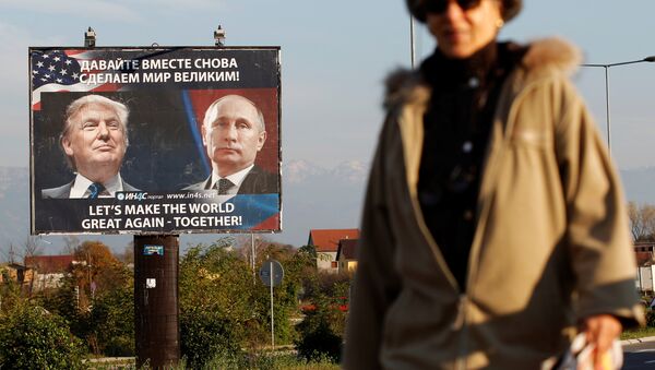 A woman passes a billboard showing a pictures of US president-elect Donald Trump and Russian President Vladimir Putin in Danilovgrad, Montenegro, November 16, 2016 - Sputnik International