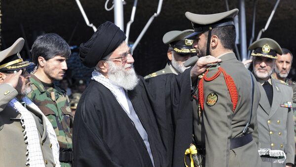 In this Thursday, Nov. 10, 2011 file photo released by the official website of the Iranian supreme leader's office, Iranian supreme leader Ayatollah Ali Khamenei, center, confers a rank to an unidentified member of Iran's army during a ceremony, in Tehran, Iran - Sputnik International
