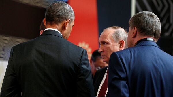 U.S. President Barack Obama talks with Russian President Vladimir Putin at the APEC Economic Leaders’ Meeting in Lima, Peru - Sputnik International