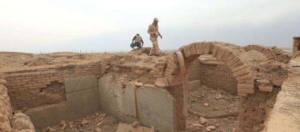 A member of Iraqi army walks at the remains of wall panels and colossal statues of winged bulls, destroyed by Islamic State militants in the Assyrian city of Nimrud eastern bank of the Tigris River, south of Mosul, Iraq, November 16, 2016. A member of Iraqi army walks at the remains of wall panels and colossal statues of winged bulls, destroyed by Islamic State militants in the Assyrian city of Nimrud eastern bank of the Tigris River, south of Mosul, Iraq, November 16, 2016. - Sputnik International