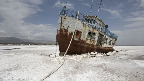 FILE - In this Friday, April 29, 2011 file photo, an abandoned ship is stuck in the solidified salts of the Oroumieh Lake, Iran. - Sputnik International