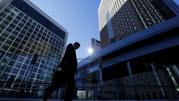 A businessman walks in Tokyo's business district, Japan - Sputnik International