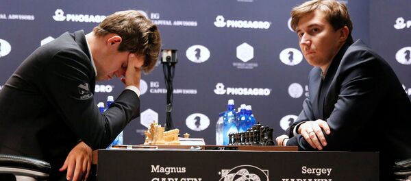 Magnus Carlsen, of Norway, reacts at his match with Sergey Karjakin, of Russia Magnus Carlsen, of Norway, reacts at his match with Sergey Karjakin, of Russia - Sputnik International