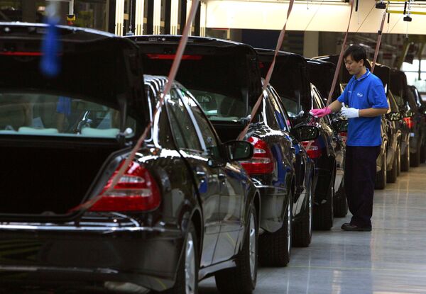 A Chinese factory worker puts final touches on the assembly line at the DaimlerChrysler factory in Beijing, China. (File) A Chinese factory worker puts final touches on the assembly line at the DaimlerChrysler factory in Beijing, China. (File) - Sputnik International