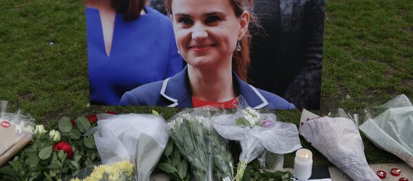 Floral tributes and candles placed by a picture of slain Labour MP Jo Cox at a vigil in Parliament square in London. (File) Floral tributes and candles placed by a picture of slain Labour MP Jo Cox at a vigil in Parliament square in London. (File) - Sputnik International