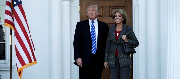 US President-elect Donald Trump (L) stands with Betsy DeVos after their meeting at the main clubhouse at Trump National Golf Club in Bedminster, New Jersey, US, November 19, 2016. - Sputnik International