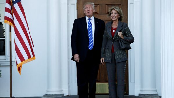 US President-elect Donald Trump (L) stands with Betsy DeVos after their meeting at the main clubhouse at Trump National Golf Club in Bedminster, New Jersey, US, November 19, 2016. - Sputnik International