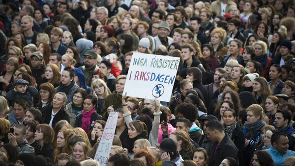 Anti-racist protestors hold a banner reading No Racist In The Parliament during a demo held at Sergels Torg in Stockholm (File) - Sputnik International