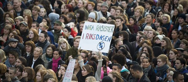 Anti-racist protestors hold a banner reading No Racist In The Parliament during a demo held at Sergels Torg in Stockholm (File) - Sputnik International