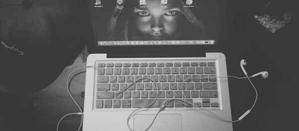 Laptop with headphones Laptop with headphones - Sputnik International