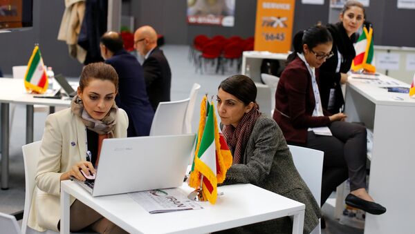 Iranian exhibitors sit in a pavilion during the opening of the fair Iran country presentation in Rome, Italy November 22, 2016 - Sputnik International