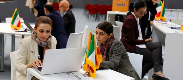 Iranian exhibitors sit in a pavilion during the opening of the fair Iran country presentation in Rome, Italy November 22, 2016 - Sputnik International