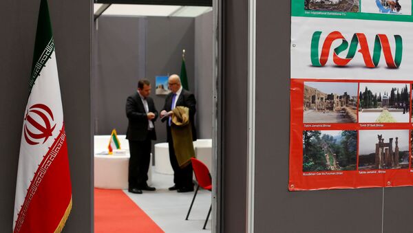 Iranian exhibitors stand in a booth during the opening of the fair Iran country presentation in Rome, Italy November 22, 2016 - Sputnik International