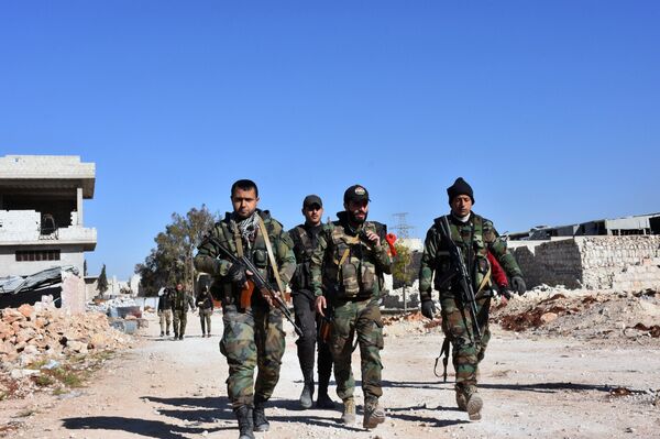 Syrian pro-government forces walk past damaged houses as they approach the Baeedin district in eastern Aleppo, near Masaken Hanano, which is still under rebel-control on November 23, 2016 Syrian pro-government forces walk past damaged houses as they approach the Baeedin district in eastern Aleppo, near Masaken Hanano, which is still under rebel-control on November 23, 2016 - Sputnik International