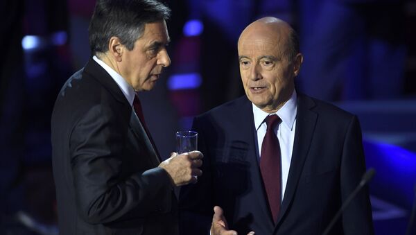 French politicians Alain Juppe, and Francois Fillon arrive on stage to attend the second prime-time televised debate for the French conservative presidential primary in Paris, France, November 3, 2016 - Sputnik International