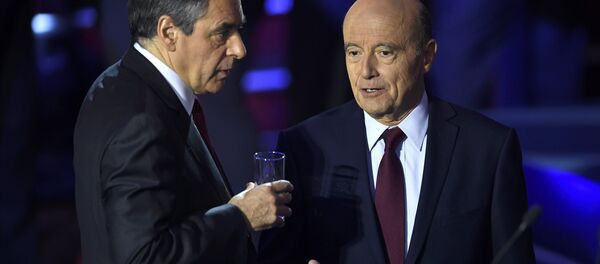 French politicians Alain Juppe, and Francois Fillon arrive on stage to attend the second prime-time televised debate for the French conservative presidential primary in Paris, France, November 3, 2016 - Sputnik International