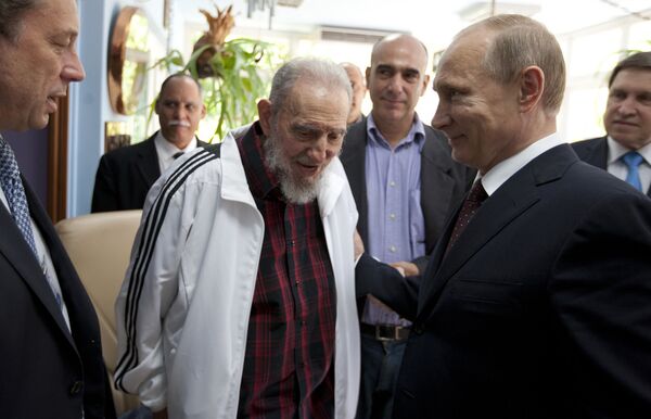 In this July 11, 2014 file photo, Cuba's Fidel Castro, center, visits with Russia's President Vladimir Putin, right, in Havana, Cuba. In this July 11, 2014 file photo, Cuba's Fidel Castro, center, visits with Russia's President Vladimir Putin, right, in Havana, Cuba. - Sputnik International