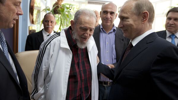 FILE - In this July 11, 2014 file photo, Cuba's Fidel Castro, center, visits with Russia's President Vladimir Putin, right, in Havana, Cuba. Social media around the world have been flooded with rumors of Castro's death, but there was no sign Friday, Jan. 9, 2015, that the reports were true, even if the 88-year-old former Cuban leader has not been seen in public for months - Sputnik International