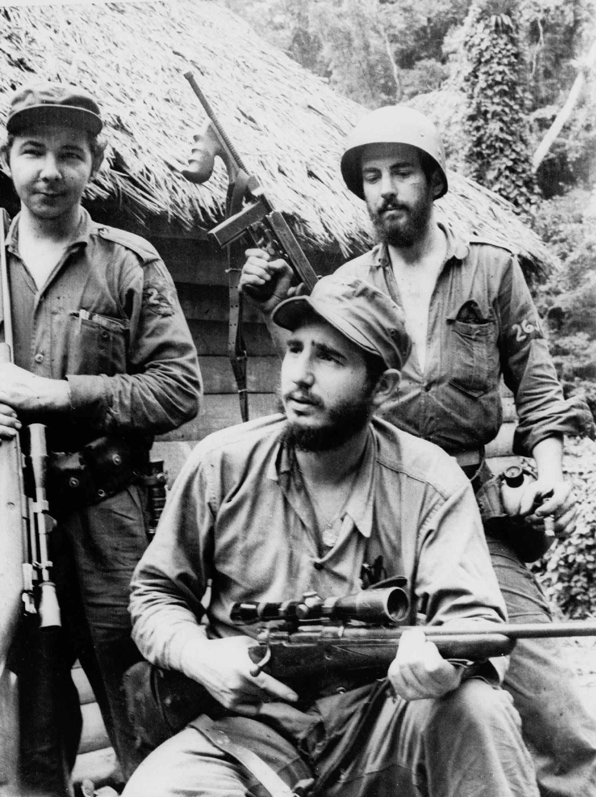 FILE - In this March 14, 1957 file photo, Fidel Castro, the young anti-Batista guerrilla leader, center, is seen with his brother Raul Castro, left, and Camilo Cienfuegos, right, while operating in the Mountains of Eastern Cuba. The man who nationalized the Cuban economy and controlled of virtually every aspect of life on the island celebrates his 90th birthday on Saturday - Sputnik International, 1920, 12.01.2025