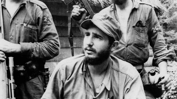 FILE - In this March 14, 1957 file photo, Fidel Castro, the young anti-Batista guerrilla leader, center, is seen with his brother Raul Castro, left, and Camilo Cienfuegos, right, while operating in the Mountains of Eastern Cuba. The man who nationalized the Cuban economy and controlled of virtually every aspect of life on the island celebrates his 90th birthday on Saturday - Sputnik International