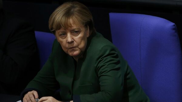 German Chancellor Angela Merkel attends a meeting at the lower house of parliament Bundestag on 2017 budget in Berlin, Germany, November 23, 2016 - Sputnik International