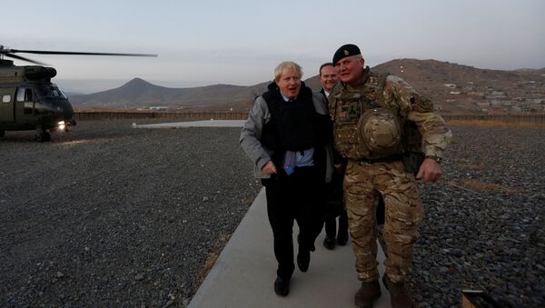 Britain's Foreign Secretary Boris Johnson (L) and Brigadier Ian Rigden, (R) Chief mentor At Afghan National Army Officer Academy arrives during his visits at Camp Qargha in Kabul, Afghanistan November 26, 2016 - Sputnik International