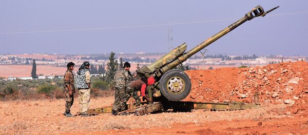 Syrian pro-government fighters fire a Russian 122mm howitzer gun as they advance in the recently recaptured village of Joubah during an offensive towards the area of Al-Bab in Aleppo province, on November 25, 2016 Syrian pro-government fighters fire a Russian 122mm howitzer gun as they advance in the recently recaptured village of Joubah during an offensive towards the area of Al-Bab in Aleppo province, on November 25, 2016 - Sputnik International