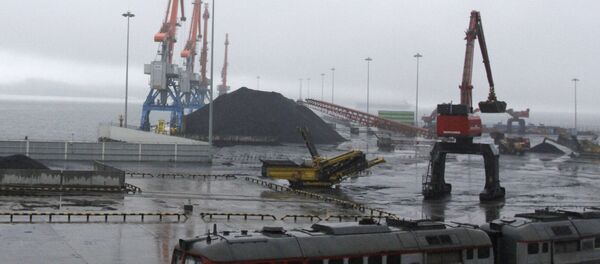In this July 24, 2016 photo, coal brought from Siberia are be seen awaiting loading onto a ship bound for China in the North Korean special economic zone of Rason In this July 24, 2016 photo, coal brought from Siberia are be seen awaiting loading onto a ship bound for China in the North Korean special economic zone of Rason - Sputnik International