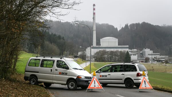Two cars from the Swiss power production and distribution company BKW block access to the road leading to the Muhleberg nuclear power plant to prevent demonstrations near the Swiss capital Bern on November 27, 2016 - Sputnik International
