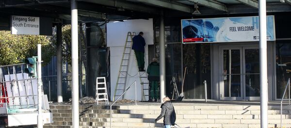 Workers repair the entrance at the fair grounds in Hamburg, Germany, Sunday Nov, 27, 2016 Workers repair the entrance at the fair grounds in Hamburg, Germany, Sunday Nov, 27, 2016 - Sputnik International