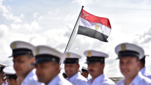Egyptian soldiers stand as the Egyptian flag is raised on the BPC Anwar el Sadate military cruise ship during the flag ceremony on September 16, 2016 in Saint-Nazaire, western France - Sputnik International