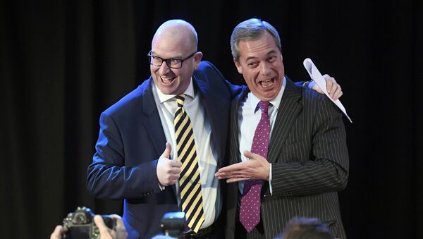 United Kingdom Independence Party (UKIP) interim leader Nigel Farage (R) embraces newly elected leader Paul Nuttall, in London, Britain November 28, 2016 - Sputnik International