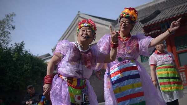 Two elderly women perform a dance at a park near the Forbidden City in Beijing - Sputnik International