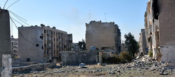 Damaged buildings are pictured in Hanano housing district after government forces took control of the area in Aleppo, Syria in this handout picture provided by SANA on November 27, 2016. Damaged buildings are pictured in Hanano housing district after government forces took control of the area in Aleppo, Syria in this handout picture provided by SANA on November 27, 2016. - Sputnik International