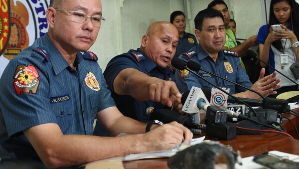 Philippine police chief Director-General Ronald Dela Rosa talks about the improvised explosive device found by a street sweeper near the US embassy during a press conference at the police headquarters in Manila - Sputnik International