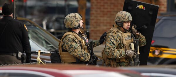 Law enforcement officials are seen outside of a parking garage on the campus of Ohio State University as they respond to an active attack in Columbus, Ohio Law enforcement officials are seen outside of a parking garage on the campus of Ohio State University as they respond to an active attack in Columbus, Ohio - Sputnik International