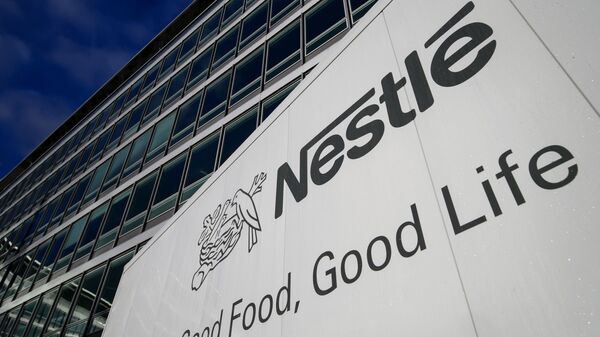 A sign of the world's biggest food company Nestle is seen at their headquarters on October 17, 2013 in Vevey - Sputnik International