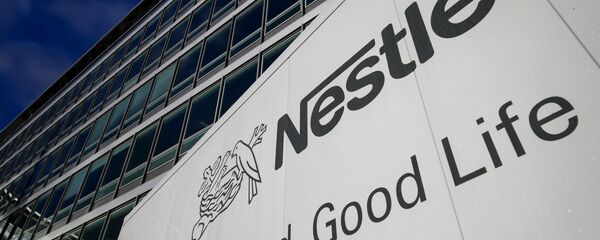 A sign of the world's biggest food company Nestle is seen at their headquarters on October 17, 2013 in Vevey - Sputnik International