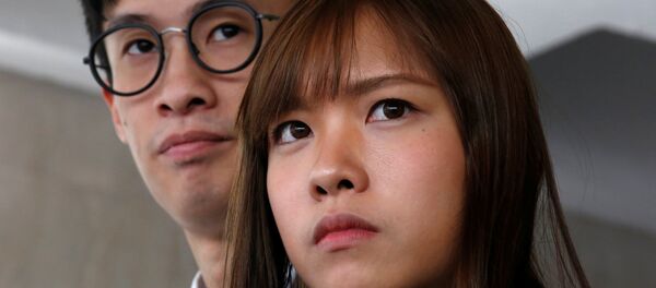 Pro-independence activists Yau Wai-Ching (R) and Baggio Leung meet journalists outside High Court after they lost an appeal against their disqualification as lawmakers in Hong Kong, China November 30, 2016. Pro-independence activists Yau Wai-Ching (R) and Baggio Leung meet journalists outside High Court after they lost an appeal against their disqualification as lawmakers in Hong Kong, China November 30, 2016. - Sputnik International