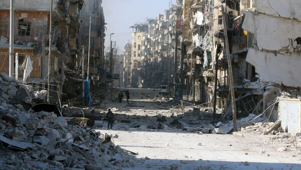 Syrians walk over rubble of damaged buildings, while carrying their belongings, as they flee clashes between government forces and rebels in Tariq al-Bab and al-Sakhour neighborhoods of eastern Aleppo towards other rebel held besieged areas of Aleppo, Syria. - Sputnik International