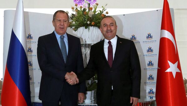 Russian Foreign Minister Sergei Lavrov shakes hands with his Turkish counterpart Mevlut Cavusoglu in Alanya, Turkey, December 1, 2016. - Sputnik International